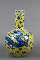 A Chinese globular lemon yellow and underglaze blue 'dragon' vase with six-character Xuande mark but