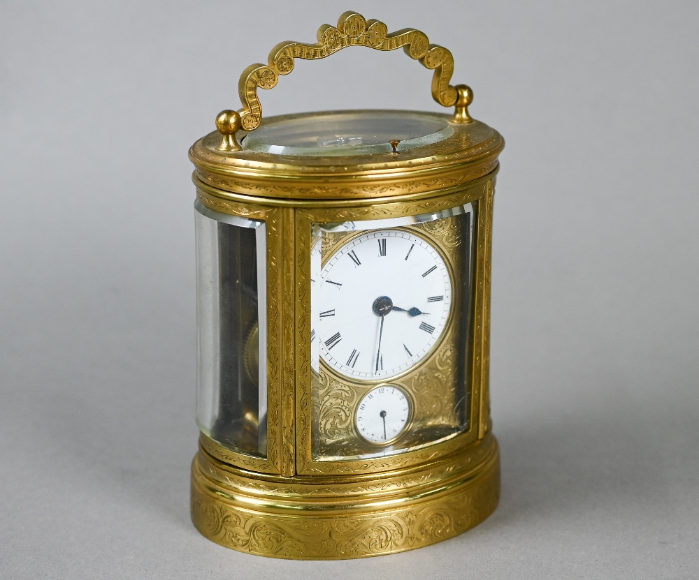 W H Tooke, Paris, an engraved oval brass alarm carriage clock, the two train movement no 1013 with