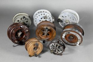 Three vintage wooden centre-pin fishing reels to/w a 'Modernite' reel and four metal reels (8)