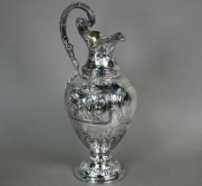 A Victorian silver wine ewer in the Renaissance manner, of baluster form with hinged cover and