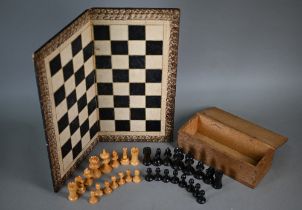 An antique set of turned wood chessmen in the Staunton manner, the king 7 cm high (one pawn
