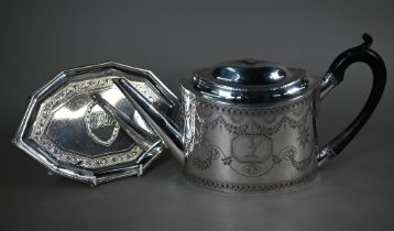 A George III silver teapot of elliptical form with bright-cut and wrigglework engraving and stag's