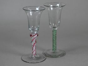 An 18th Century cordial glass with bell bowl on double-knop opaque red and white twist stem, the