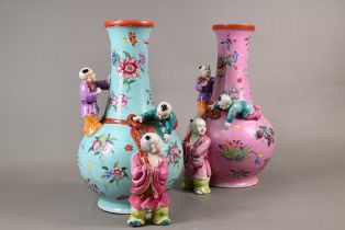 Two 20th century Chinese 'boys' vases, one in pink (Qianlong mark) and one in light blue (