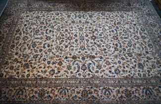 A central Persian Kashan carpet, the overall floral vine design on camel ground, 400 cm x 290 cm