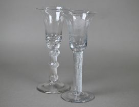 A Jacobite-style drinking glass, the bell bowl etched with roses and butterfly, on air twist stem
