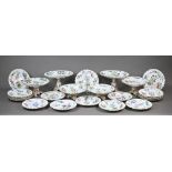 An early 19th century Staffordshire china dessert service, finely-painted with floral specimens,