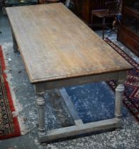 A large contemporary oak top refectory dining table, raised on a distressed grey painted base of six