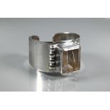 Navajo interest - A Sam Piaso white metal cuff bracelet set with large rectangular rutilated quartz,