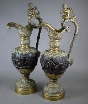 A pair of 19th century Continental brass and bronze garniture ewers in the Renaissance manner, the