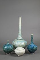 Three Willy van Bussel studio pottery bottle vases to/w a small pot and cover, all with