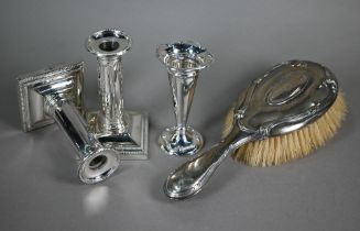 An Edwardian silver-backed hairbrush, Birmingham 1909, to/w a small vase-flute on weighted foot,