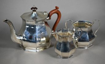 A silver three-piece tea service of octagonal form, the teapot with composite handle and finial,