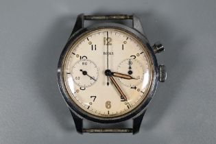 A gentlemans Birks stainless steel wristwatch, the champagne dial with Arabic numerals, subsidiary