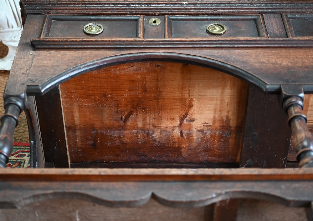 An antique oak low dresser with three double moulded front drawers over a triple arched apron, - Image 17 of 23
