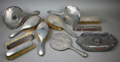 Two silver brush sets with engine-turned decoration, to/w a Victorian silver-backed hand-mirror,