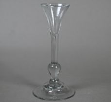 An 18th Century 'Kit Kat' glass with small trumpet bowl glass above tear-drop, on baluster knop stem