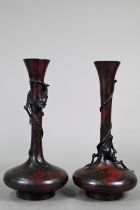 A pair of 19th century Japanese murashido red-splashed bronze dragon vases with compressed