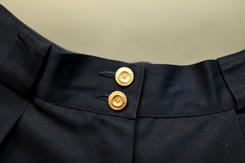 Chanel - A pair of navy trousers, with pleated front and gilt metal button detailing, fully lined, - Image 5 of 6