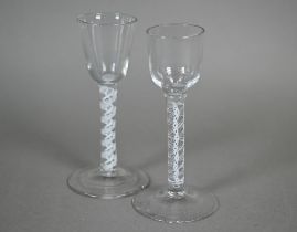 A cordial glass with ogee bowl and opaque twist stem and conical foot, 14.5 cm, to/w another glass