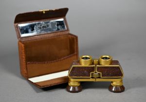 A pair of Carl Zeiss Jena Theatis 3.5 x 15 opera glasses no 1481719, in gilt metal inset with lizard