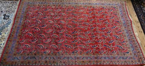 A mid-century Persian Hamadan rug, the stylised floral design on mid-red ground, 240 cm x 150 cm