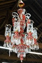 A contemporary Murano style glass, gilt and cranberry glass chandelier / electrolier, with six arms,