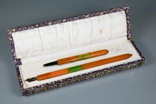 An Art Deco celluloid dip pen and propelling pencil set, in original box