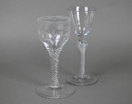 A cordial glass with round funnel bowl on air twist baluster stem and conical foot, 16 cm, to/w a