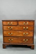 A George III mahogany chest four long graduated drawers, with brass swan-neck fittings, raised on