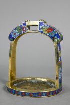 A 19th century Chinese bronze cloisonne stirrup with floral decoration in polychrome enamels, late