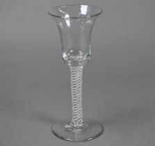 An 18th Century cordial glass with bell bowl on plain opaque twist stem with flattened foot,