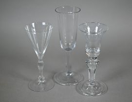 An ale glass with tapering flute bowl on plain stem and domed and folded foot, 29 cm, to/w a glass