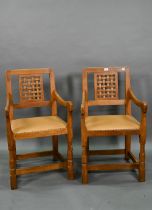 The workshop of Robert Thompson (Kilburn) a companion pair of 'Mouseman' oak carver chairs with