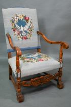 A continental moulded walnut framed open armchair, with blue embroidered dove design fabric panels