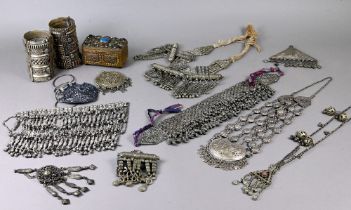 A collection of various vintage Middle Eastern jewellery items including two hinged cuffs, various