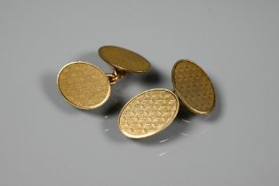 A pair of oval 9ct yellow god chain linked cufflinks with engine turned decoration, approx 8.8g
