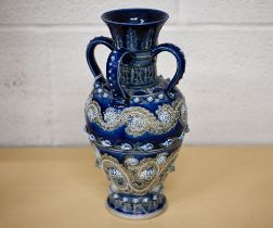 A Victorian Doulton Lambeth embosed stoneware vase with four loop handles, by George Tinworth,