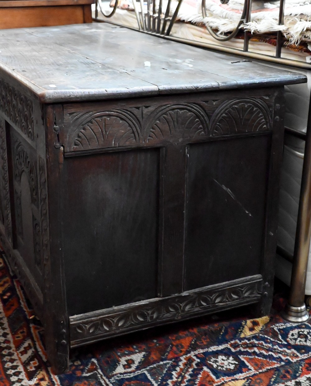 A large 18th century carved oak coffer/blanket chest (a/f), 132 cm wide x 60 cm deep x 62 cm high - Image 2 of 6