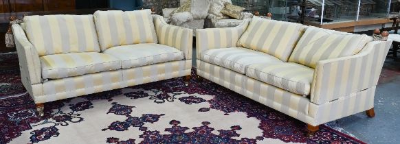 A pair of contemporary Duresta 'Trafalgar' design three seat sofas, in striped fabric, raised on