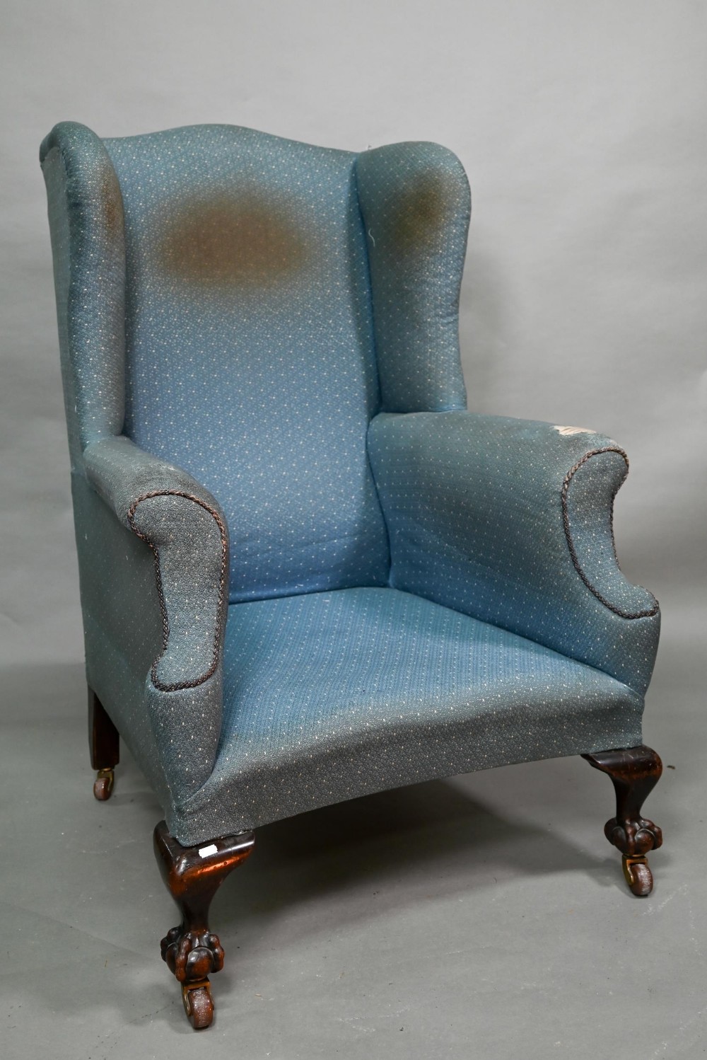 A traditionally upholstered Queen Anne style wing armchair, with concave seat front, raised on short - Image 2 of 14