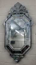 A large Venetian wall mirror, 140 x 70 cm wide