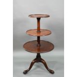 A Victorian mahogany dumb waiter, the graduated three circular tiers raised on a tripod base to