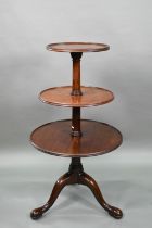 A Victorian mahogany dumb waiter, the graduated three circular tiers raised on a tripod base to