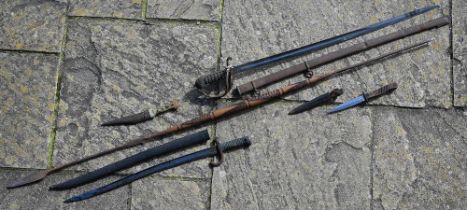 A cavalryman's sword to/w trench knife, French bayonet, Middle Eastern dagger and an African spear