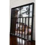 A mirror-backed wrought iron garden gate, 90 x 94 cm high