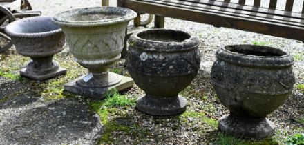 A pair of weathered cast stone garden planters to/with two others (4)