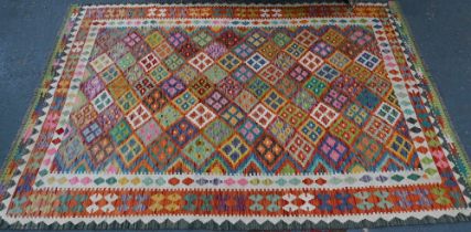 A contemporary Anatolian Turkish Kelim, overall multi-coloured geometric design, 245 cm x 178 cm