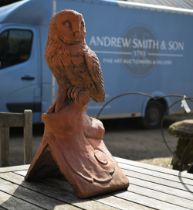 A reconstituted aged terracotta 'owl' ridge tile