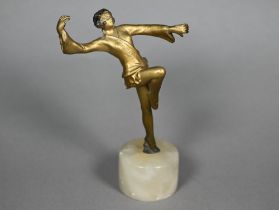 An Art Deco gilt-patinated bronzed figure of a dancing girl, unsigned, 12 cm high